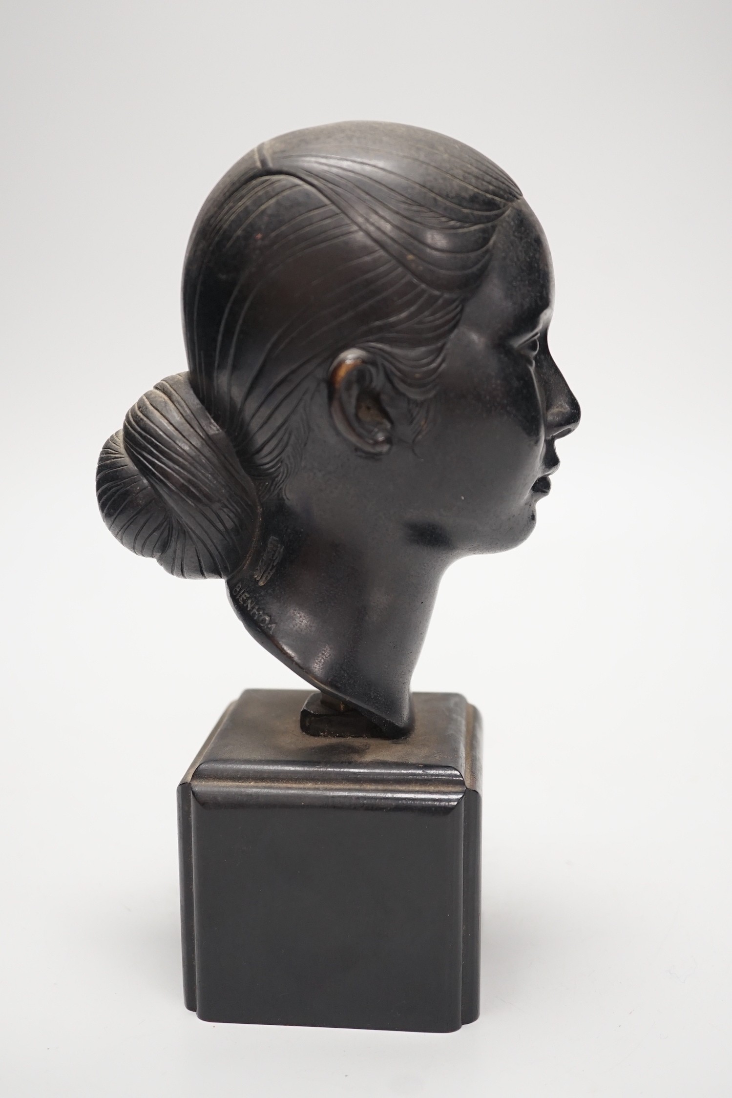 A Vietnamese Bienhao school bronze bust, signed L. Mau to neck, 23cm tall